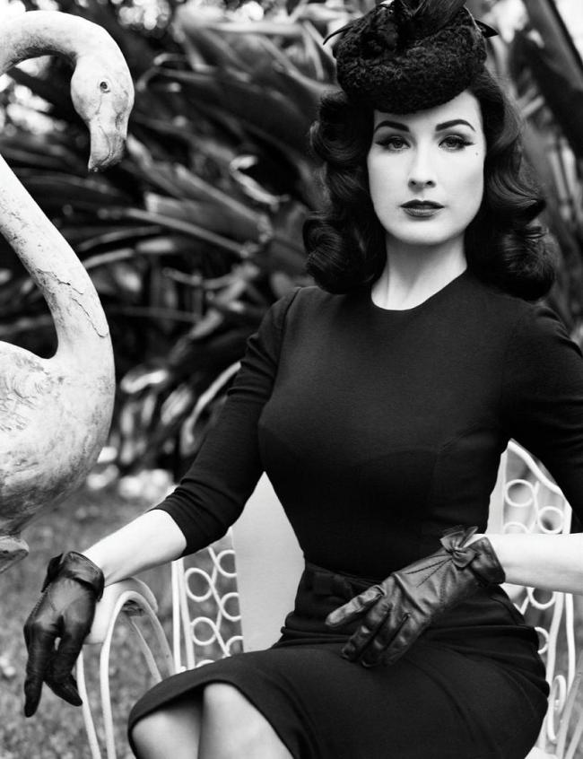 Dita von Teese wearing leather gloves in a Flaunt photoshoot.