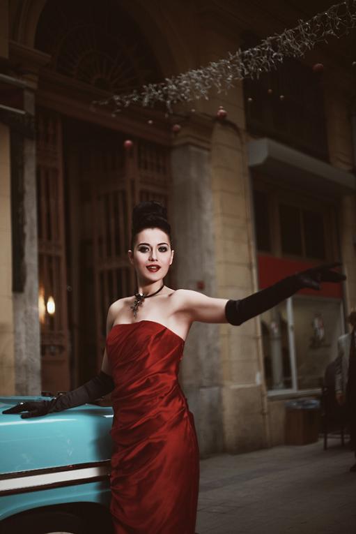 Turkish actress Fahriye Evcen wearing a lovely red satin dress and black satin opera gloves.
